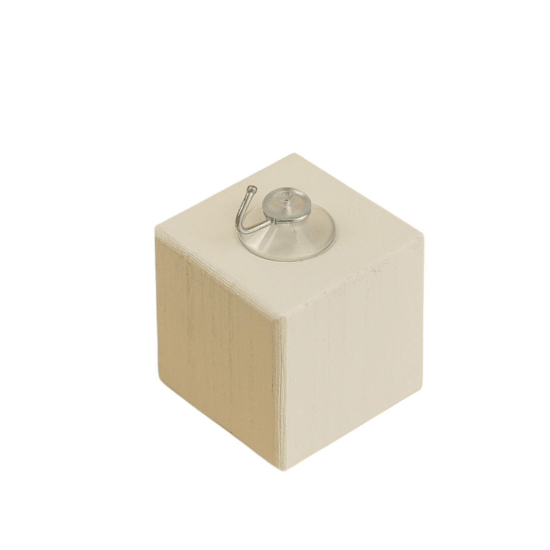 Un cube blanc avec une ventouse Crochet pour la Salle de bain – Support mural dessus, parfait pour l'organisation de la salle de bain.