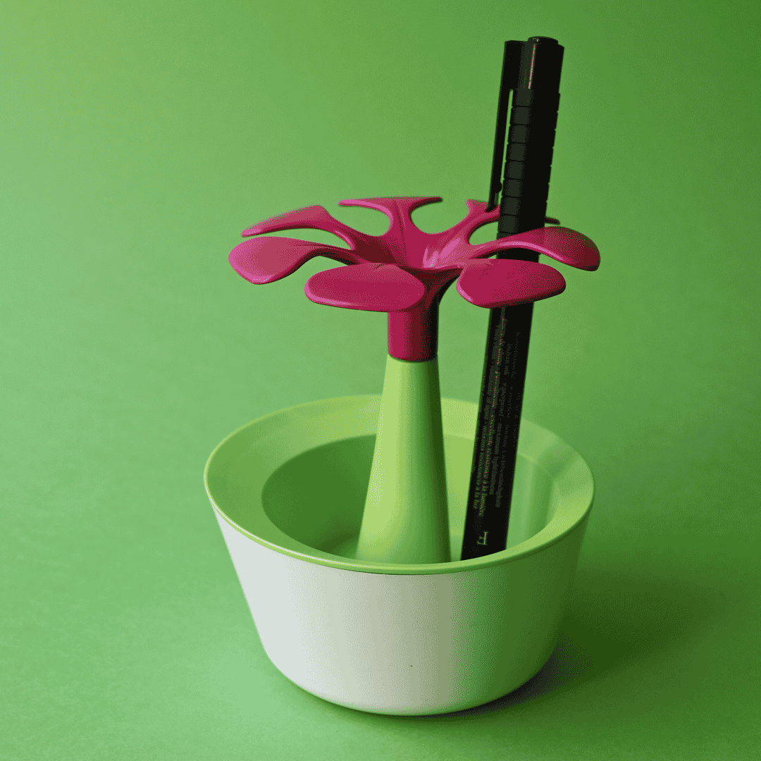 Un pot de crayons en forme de fleurs biodégradable et français avec une fleur en forme de fleurs.